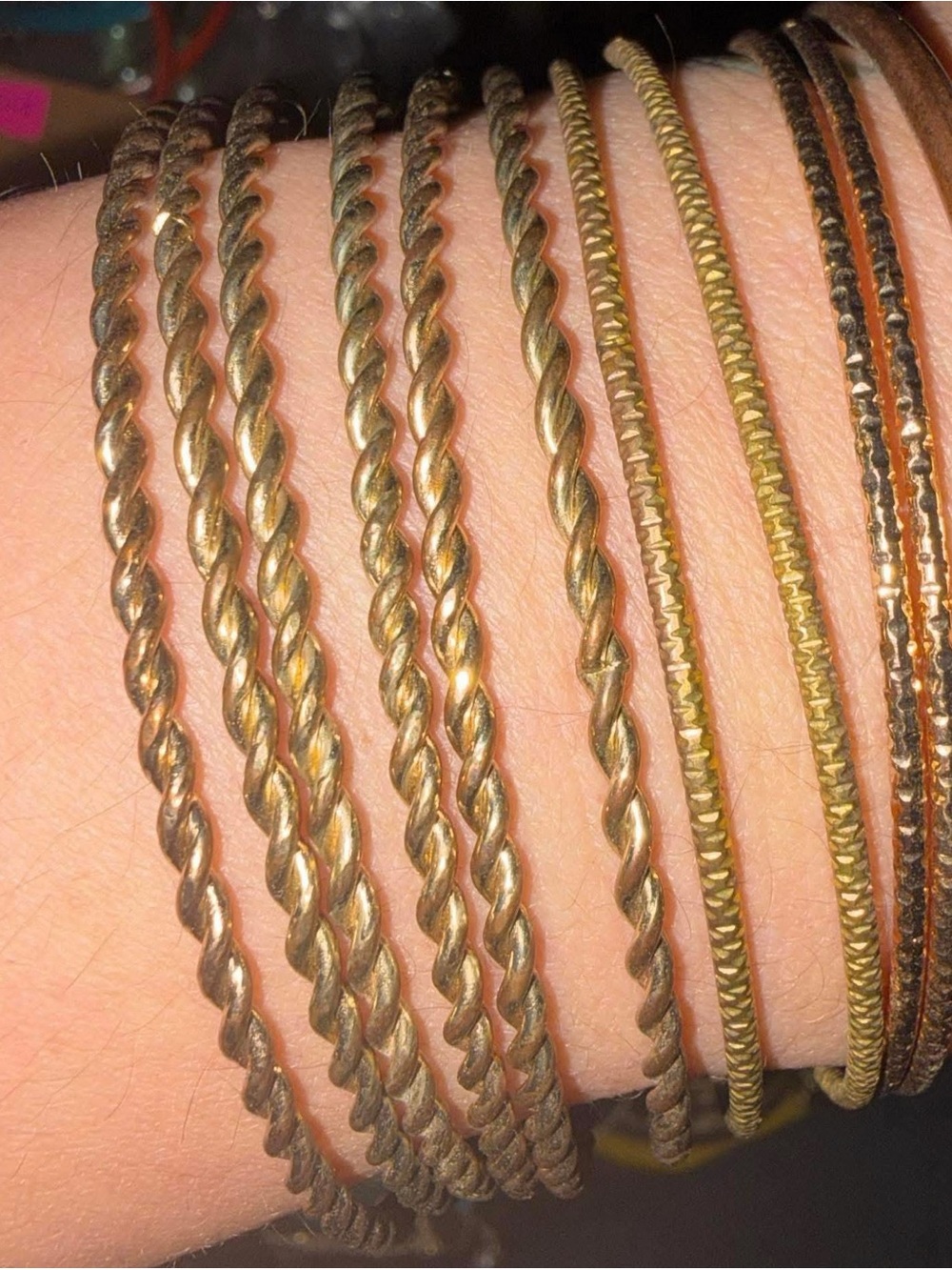 Set of 10 gold-colored bracelets